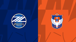 Logo Machida Zelvia berwarna biru bersanding dengan logo oranye Albirex Niigata, simbol duel “Albirex Niigata vs Machida Zelvia” di J1 League 2025.
